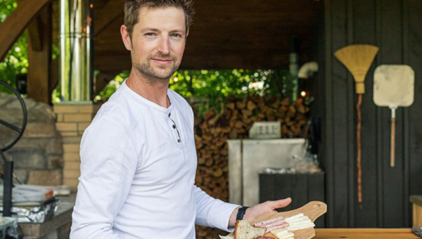 Jeff Fenwick  holding a platter of cheese