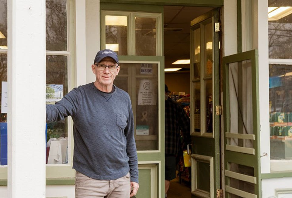 Stephen Fargo standing outside his general store
