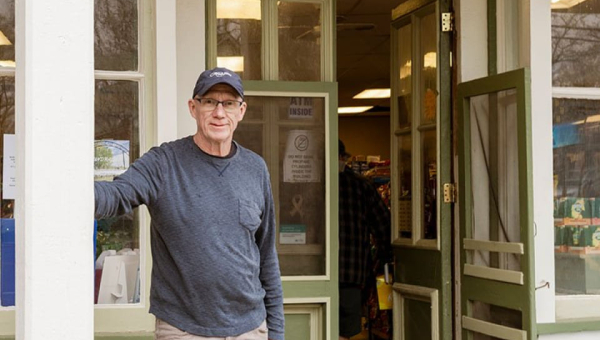 Stephen Fargo standing outside his general store