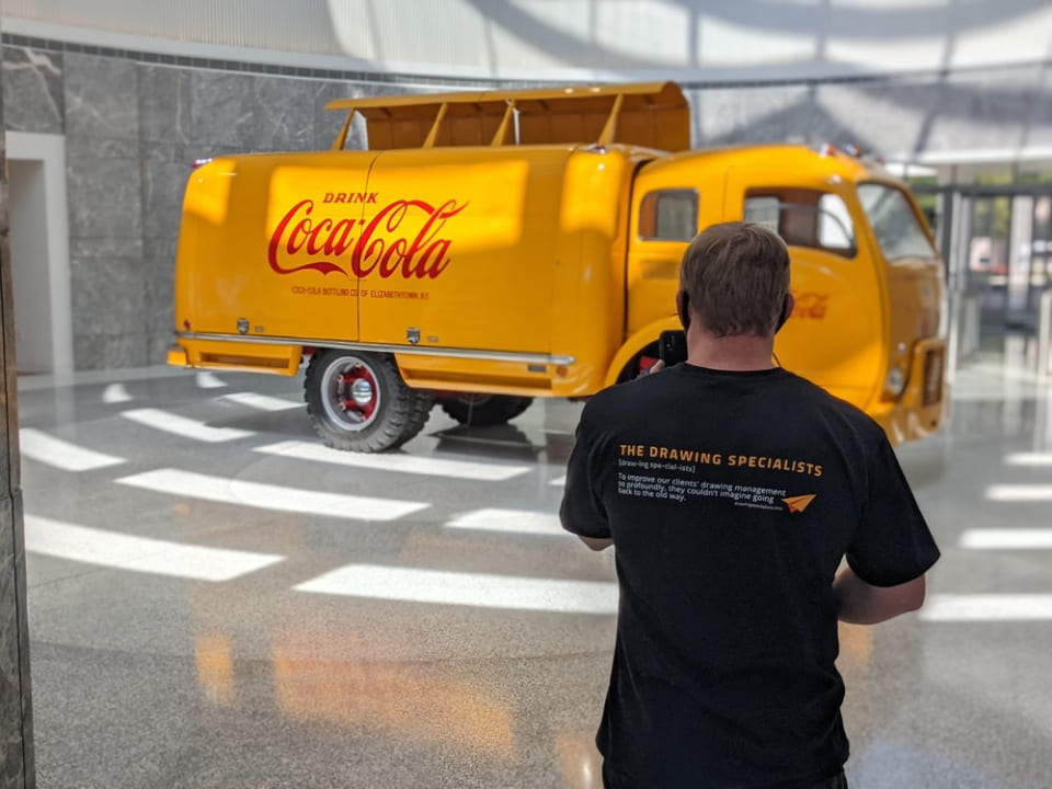 dcm - man standing in front of truck